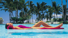 Lady on pool lounger
